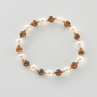 Bracelet en coquillage avec œil-de-tigre