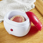 Nettoyeur de dentiers – coloris rouge et blanc