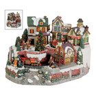 Village de Noël illuminé avec un train animé